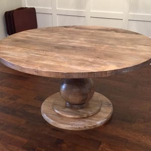 Massive table with round base