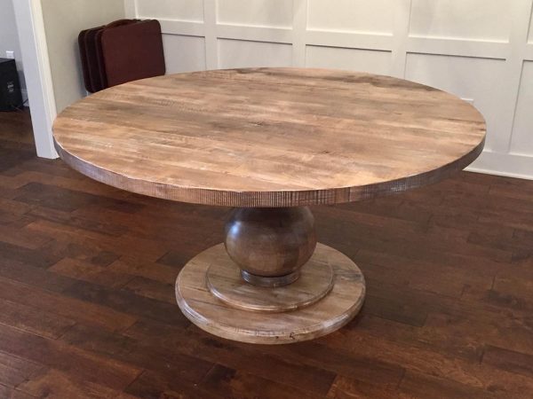 Massive table with round base