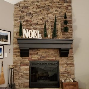 Multi-Level Mantel with Huge Corbels over a fireplace